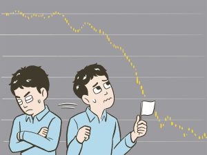 自分の投資状況に一喜一憂する男性