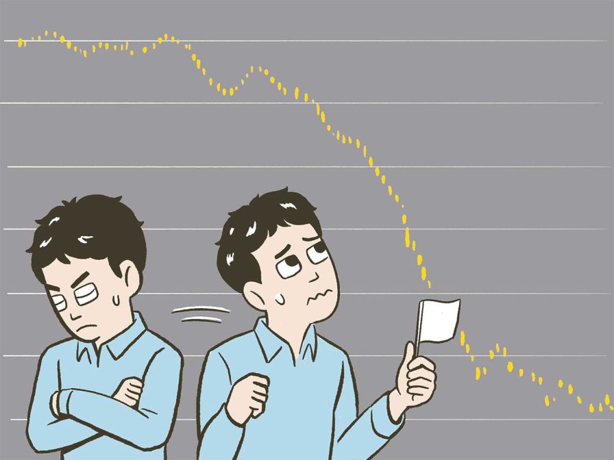 自分の投資状況に一喜一憂する男性